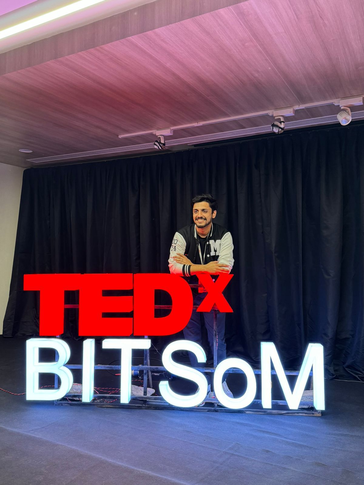 Sidhant on the TEDxBITSoM stage